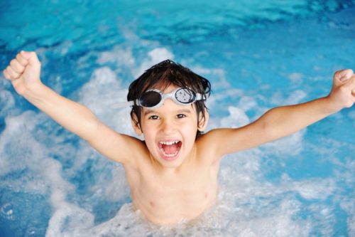 9217191 - activities on the pool, children swimming and playing in water, happiness and summertime